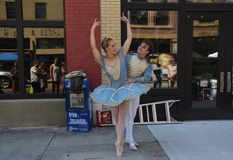 Kirsten Hyde and Dillon Davis perform on Main Street on Friday, September 18, 2015 during Park(ing) Day.