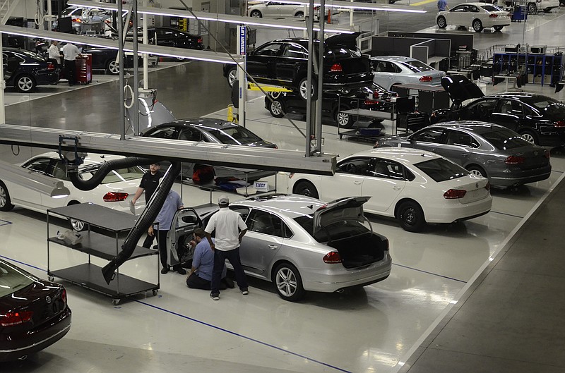 Volkswagen workers and Passats are seen at the Chattanooga manufacturing plant in this file photo.
