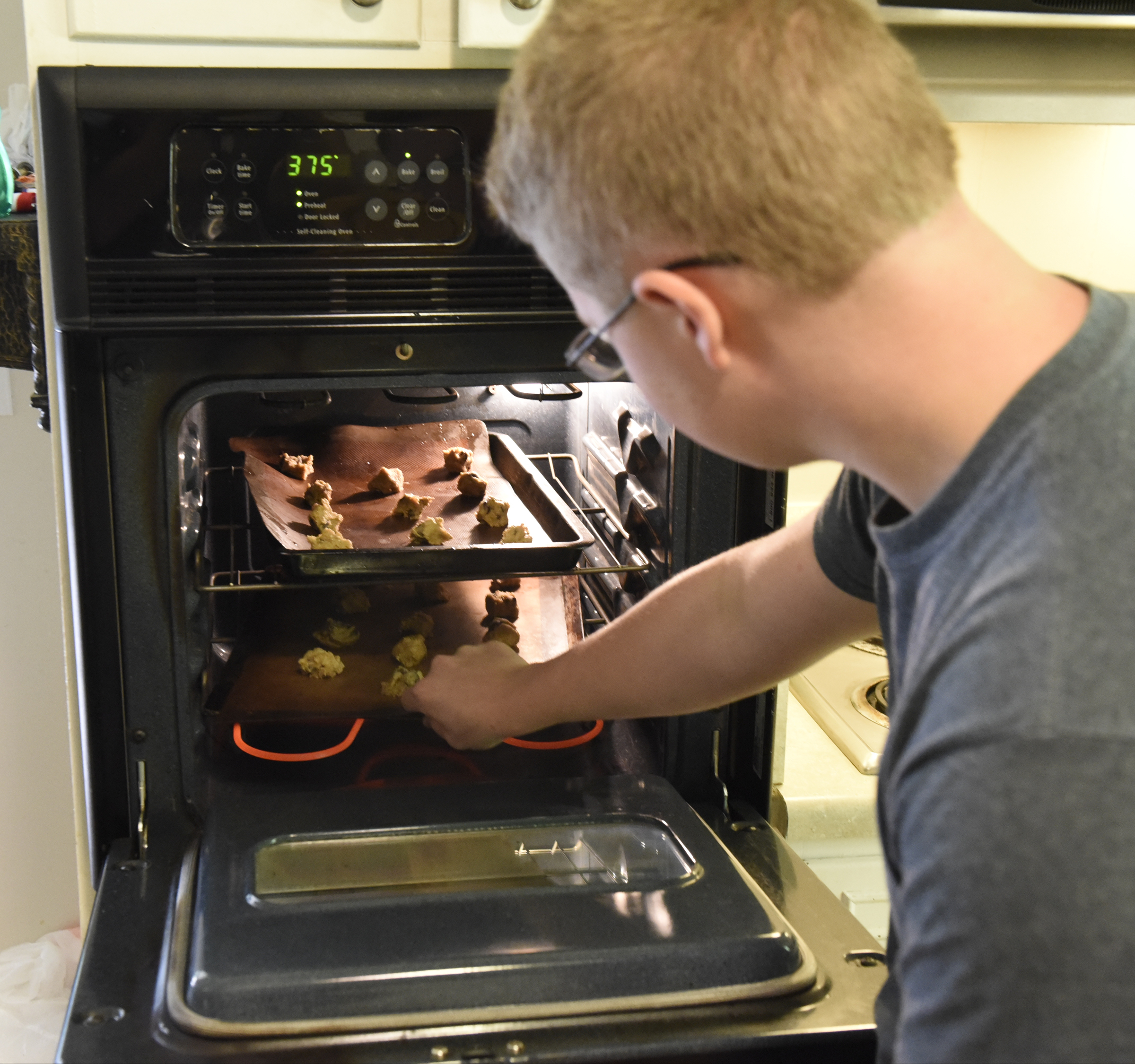 Gage Plotner makes chocolate chip cookies Thursday, Sept. 17, 2015, at his home in Soddy-Daisy, Tenn., one of his entries in the upcoming Hamilton County Fair.
