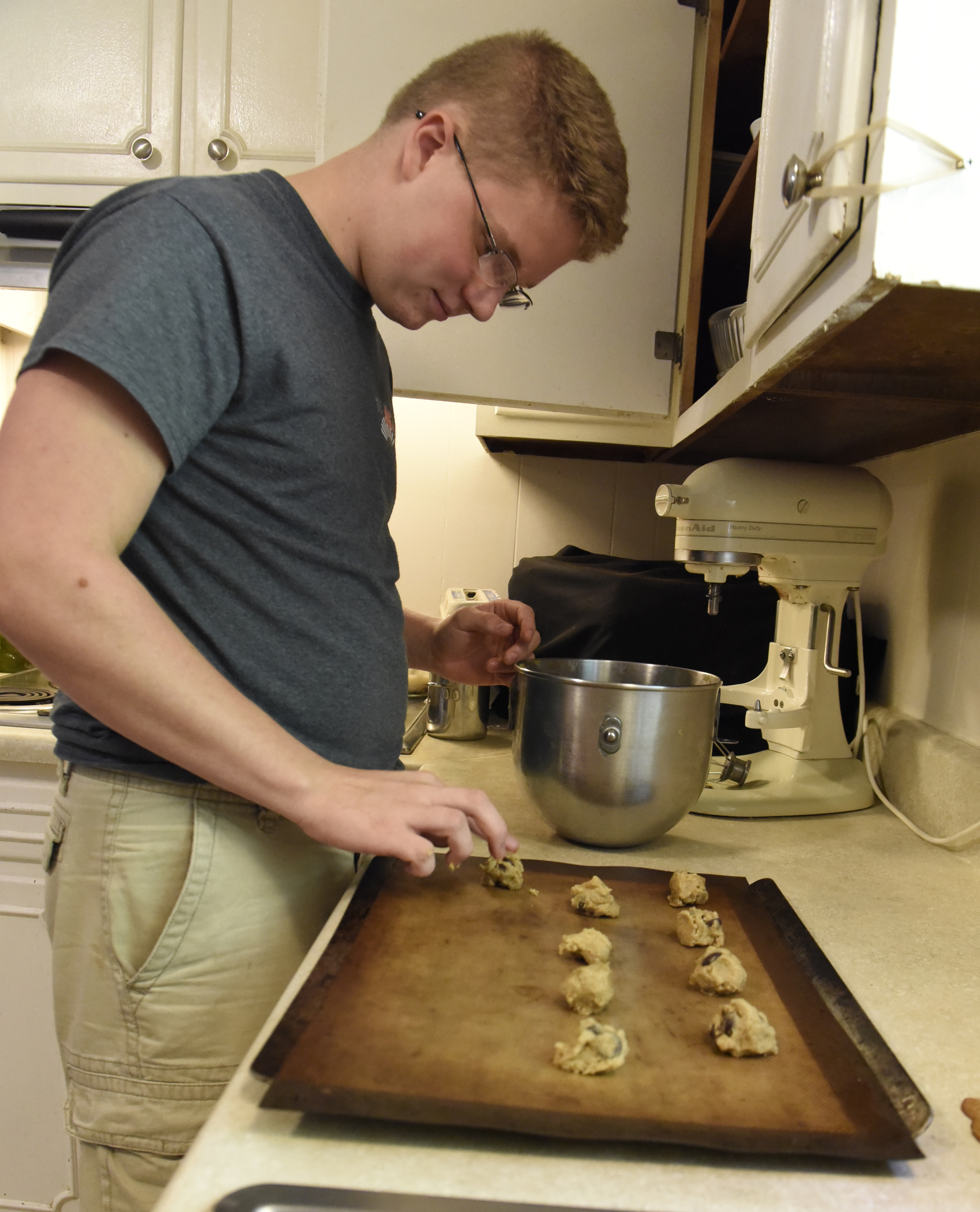 Gage Plotner makes chocolate chip cookies Thursday, Sept. 17, 2015, at his home in Soddy-Daisy, Tenn., one of his entries in the upcoming Hamilton County Fair.