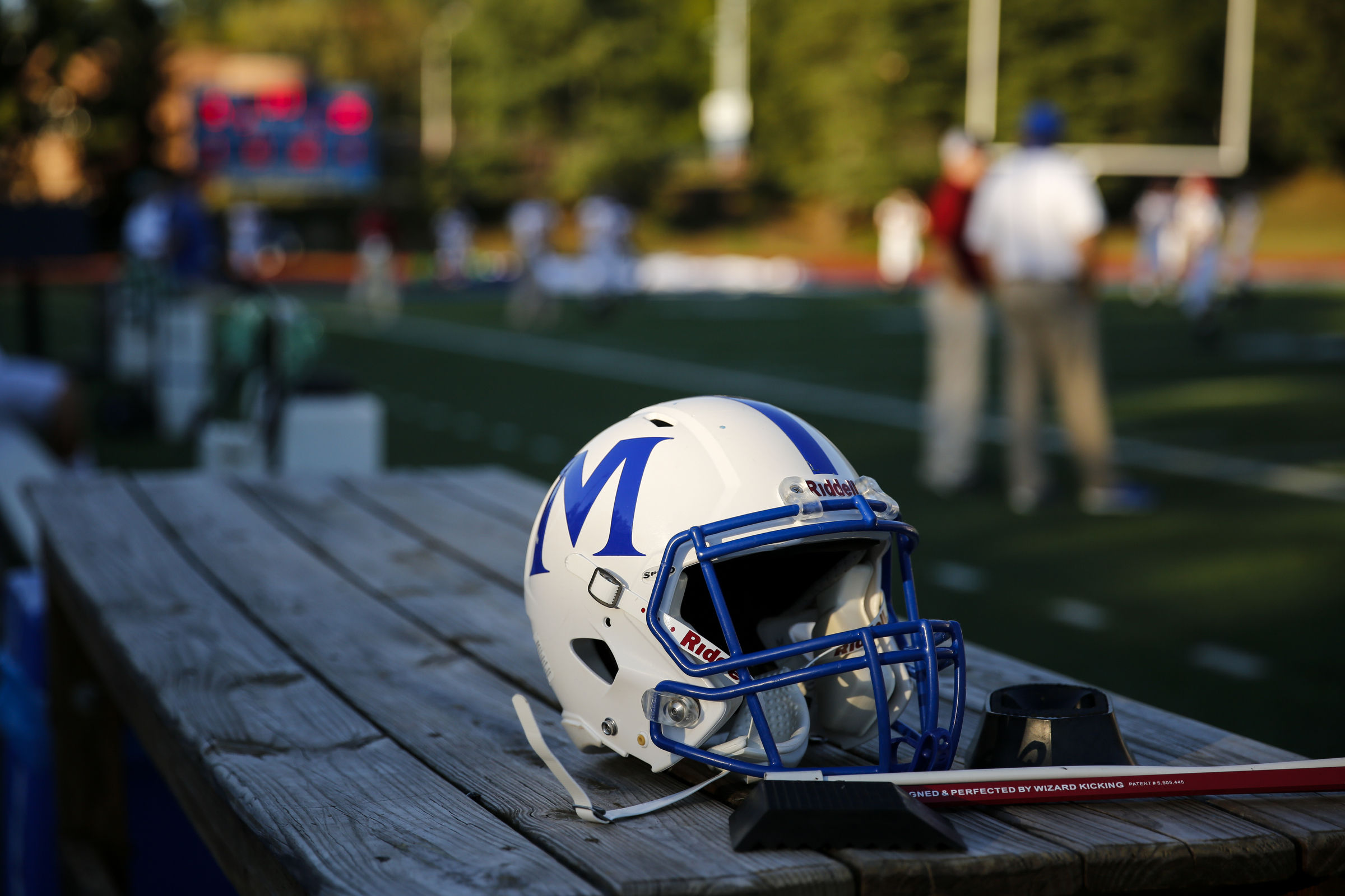 A McCallie football helmet sits on a bench on the sidelines before the tornados' prep football game against Montgomery Bell Academy at McCallie School on Friday, Sept. 18, 2015, in Chattanooga, Tenn.