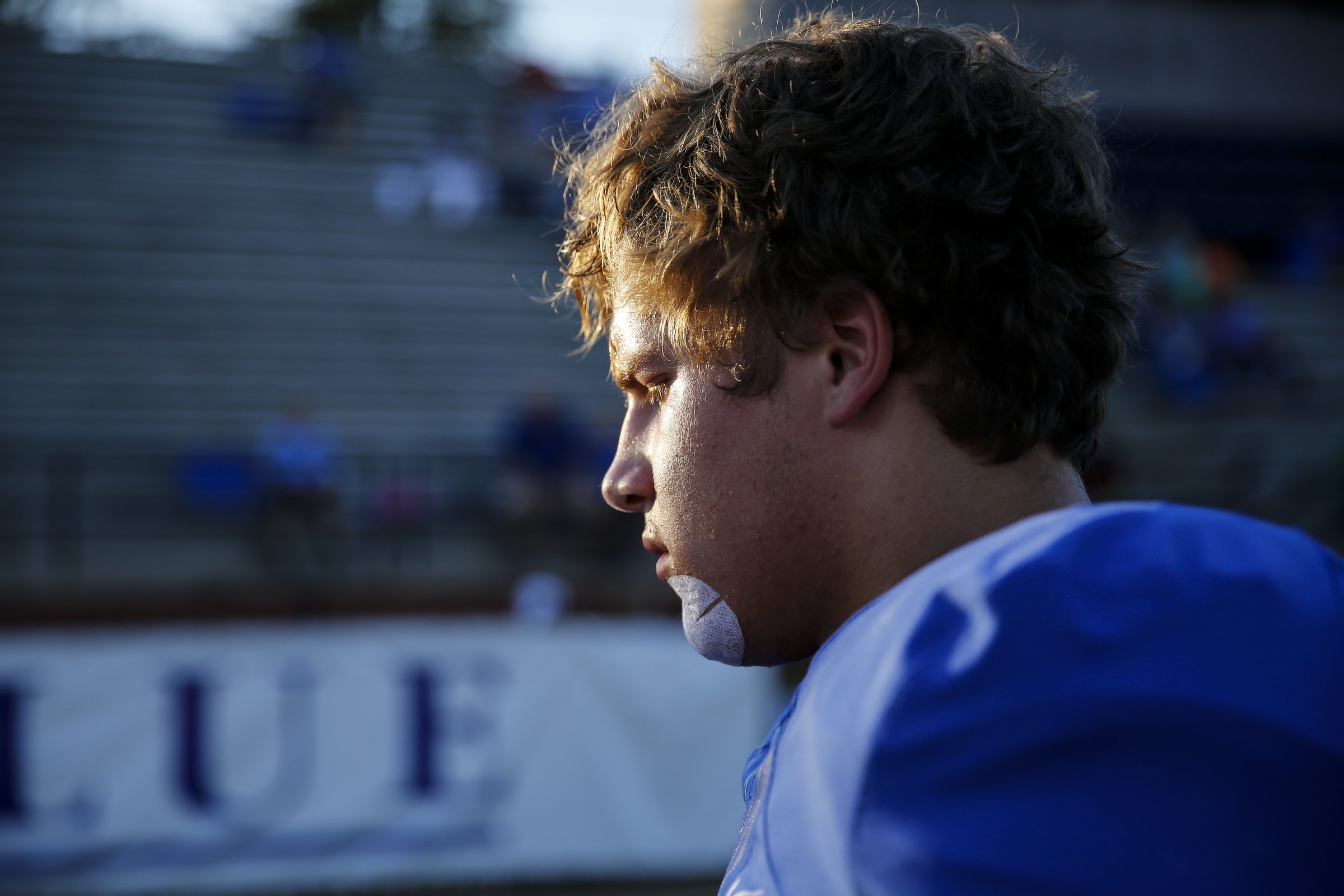 McCallie player Andrew Presley takes a breather from warmups before the tornados' prep football game against Montgomery Bell Academy at McCallie School on Friday, Sept. 18, 2015, in Chattanooga, Tenn.