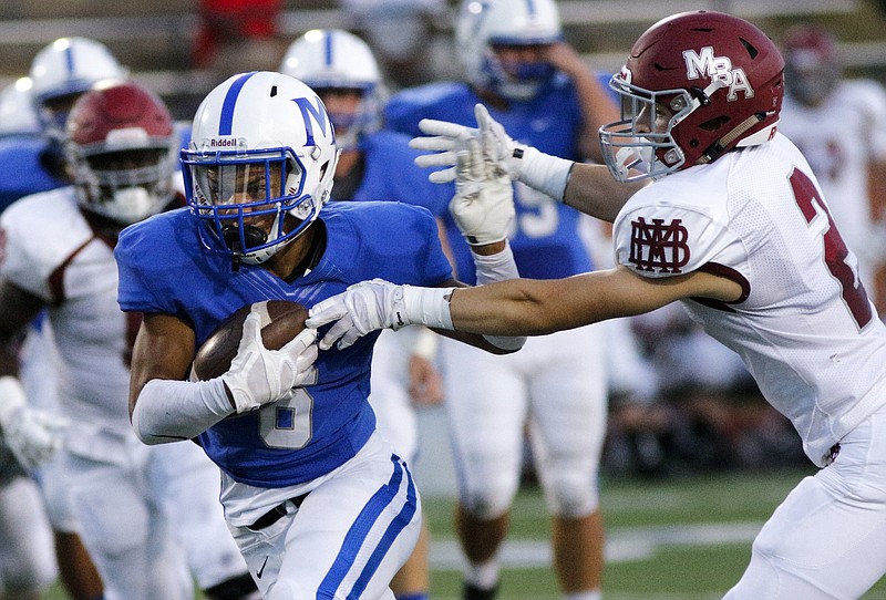 McCallie's Rico Dozier, left, evades MBA defender Montgomery Owen during the tornados' prep football game against Montgomery Bell Academy at McCallie School on Friday, Sept. 18, 2015, in Chattanooga, Tenn.