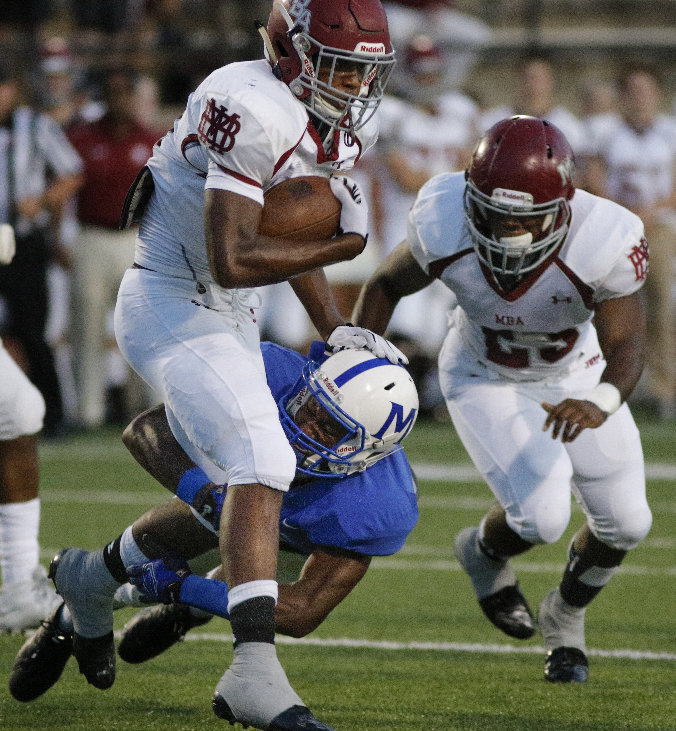 McCallie's JaVaughn Craig tackles MBA running back Ty Chandler during the tornados' prep football game against Montgomery Bell Academy at McCallie School on Friday, Sept. 18, 2015, in Chattanooga, Tenn.