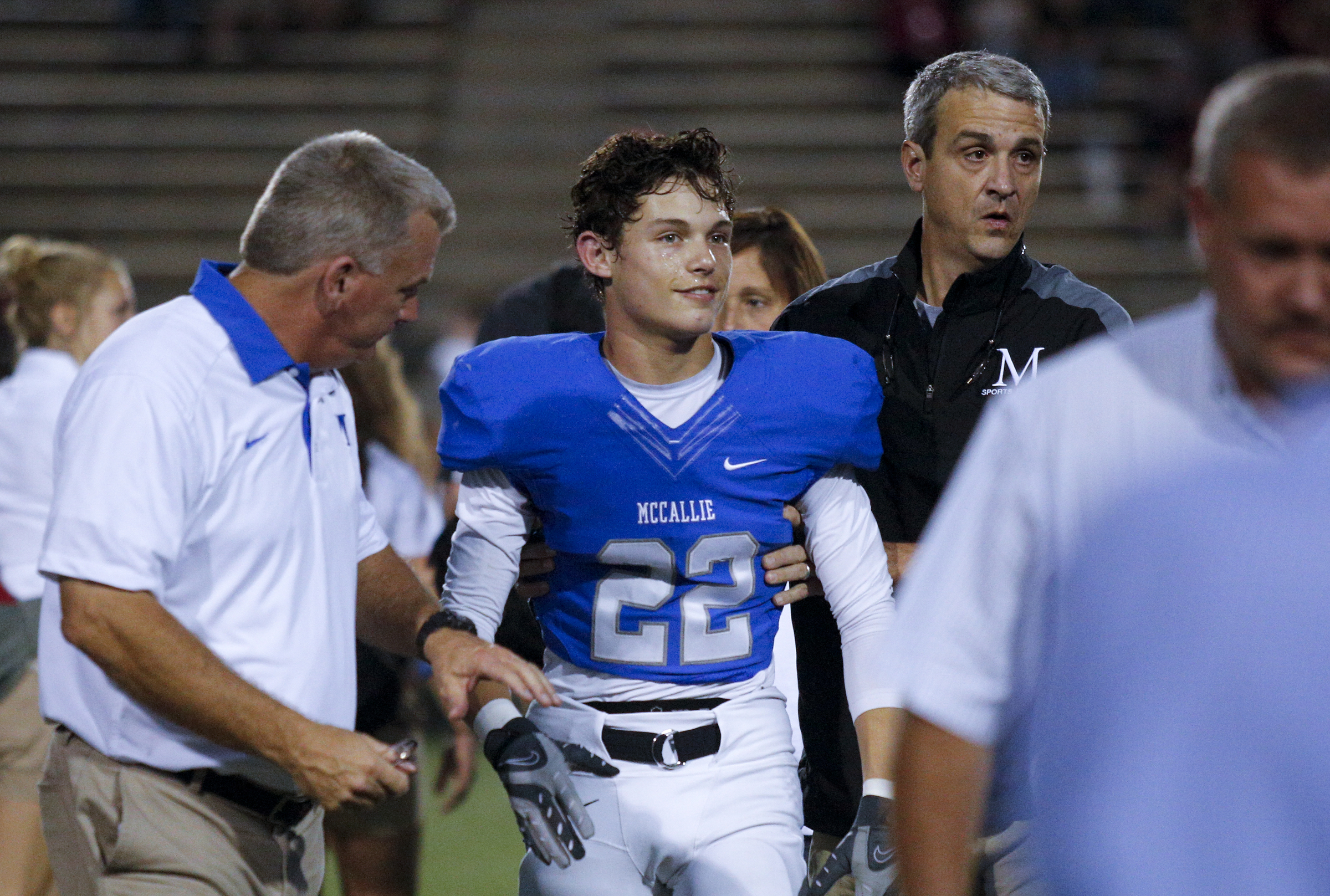 McCallie player Blaine Pritchett is helped off the field after a lengthy injury timeout on the field during the tornados' prep football game against Montgomery Bell Academy at McCallie School on Friday, Sept. 18, 2015, in Chattanooga, Tenn.