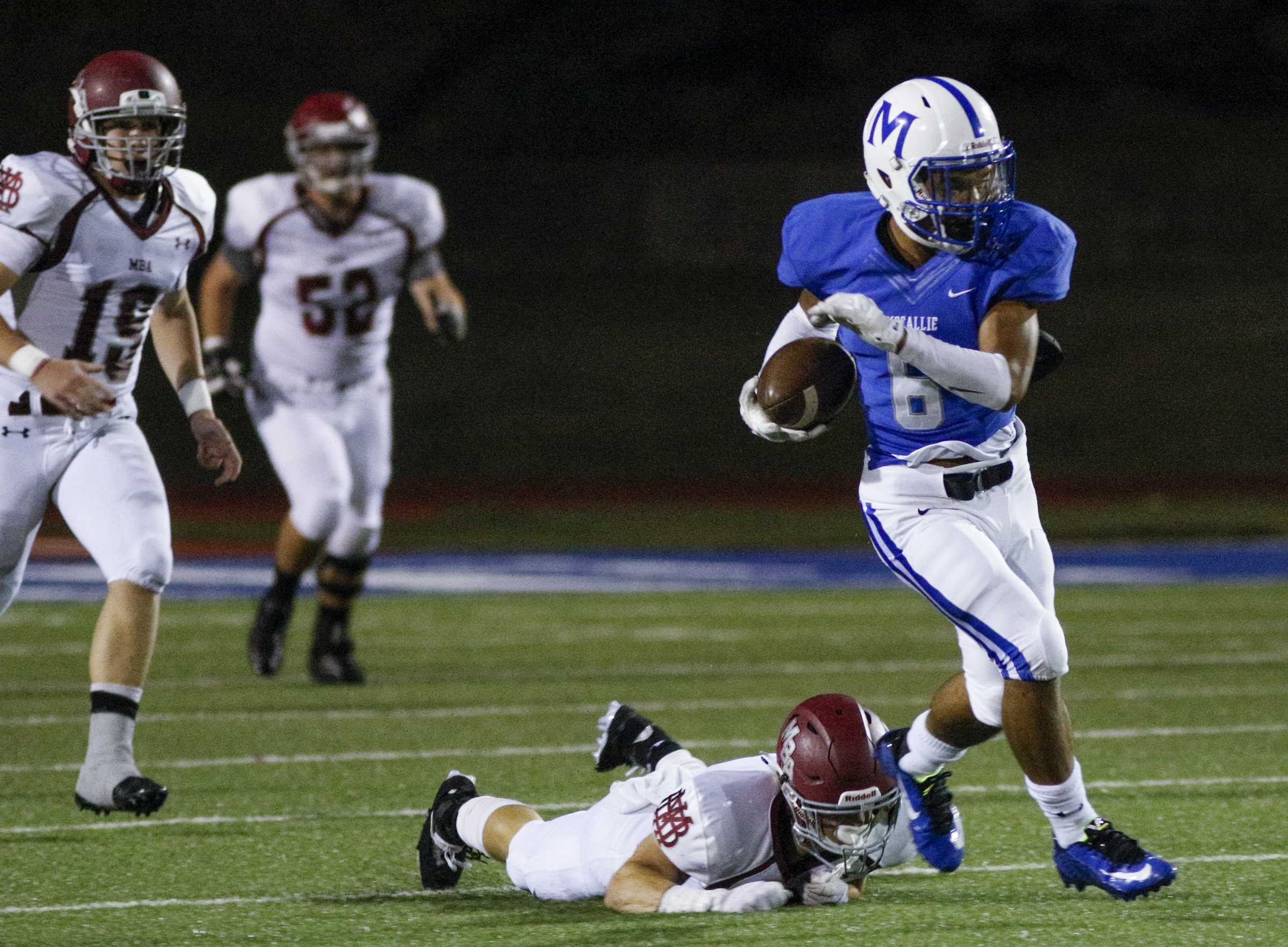 McCallie's Rico Dozier breaks away from MBA defender Montgomery Owen during the tornados' prep football game against Montgomery Bell Academy at McCallie School on Friday, Sept. 18, 2015, in Chattanooga, Tenn.