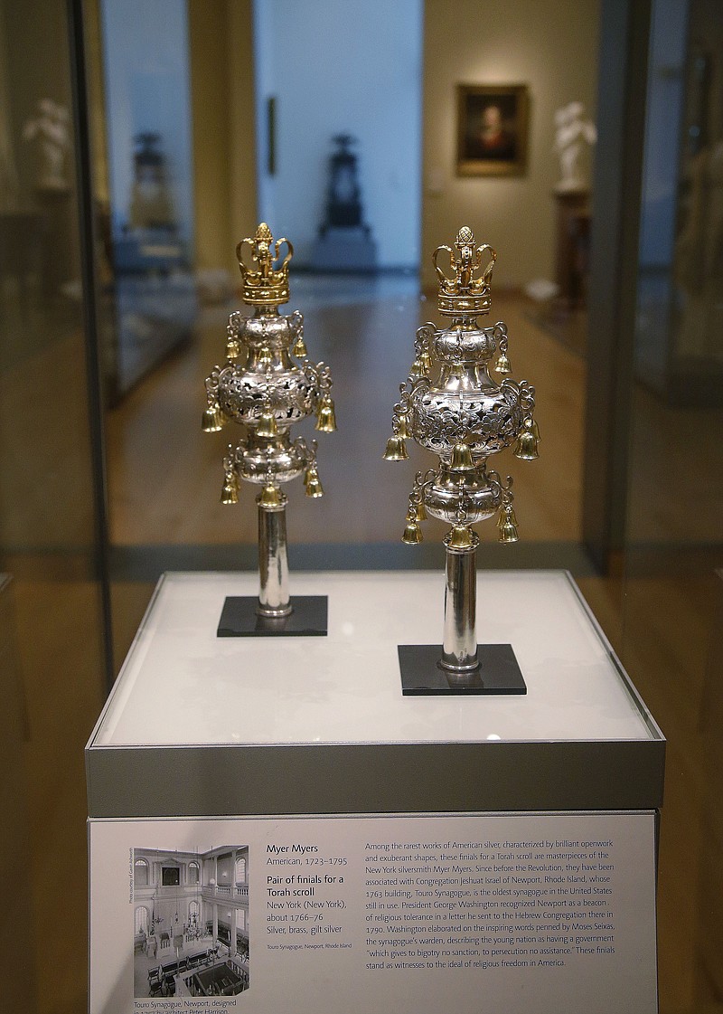 
              FILE - In this June 1, 2015, file photo, ceremonial bells belonging to the 250-year-old Touro Synagogue in Newport, R.I., and worth more than $7 million are on display at the Museum of Fine Arts in Boston. A federal judge overseeing a trial over control of the nation’s oldest synagogue and ceremonial bells said on Friday, Sept. 18, there is no “smoking gun,” in the battle between the congregation that worships at the 250-year-old Touro Synagogue in Newport and the nation's first Jewish congregation, in New York. (AP Photo/Stephan Savoia, File)
            