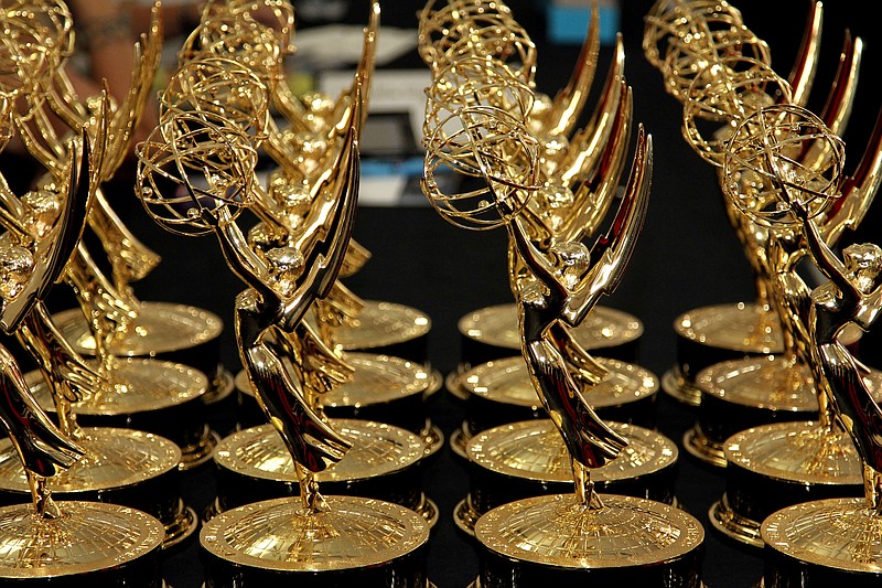 
              FILE - In this Sept. 23, 2012 file photo, statues of the 64th Emmy awards are displayed on a table backstage at the 64th Primetime Emmy Awards at the Nokia Theatre in Los Angeles. The 67th annual Primetime Emmy Awards airs Sunday, Sept. 20, 2015, at 8 ET/5 PT on FOX.  (Photo by Matt Sayles/Invision/AP, File)
            