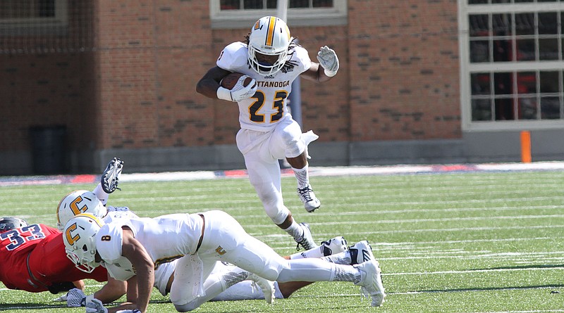 Running back Richardre Bagley follows sensational blocking in picking up yardage for UTC in its 31-21 Southern Conference win Saturday over Samford.