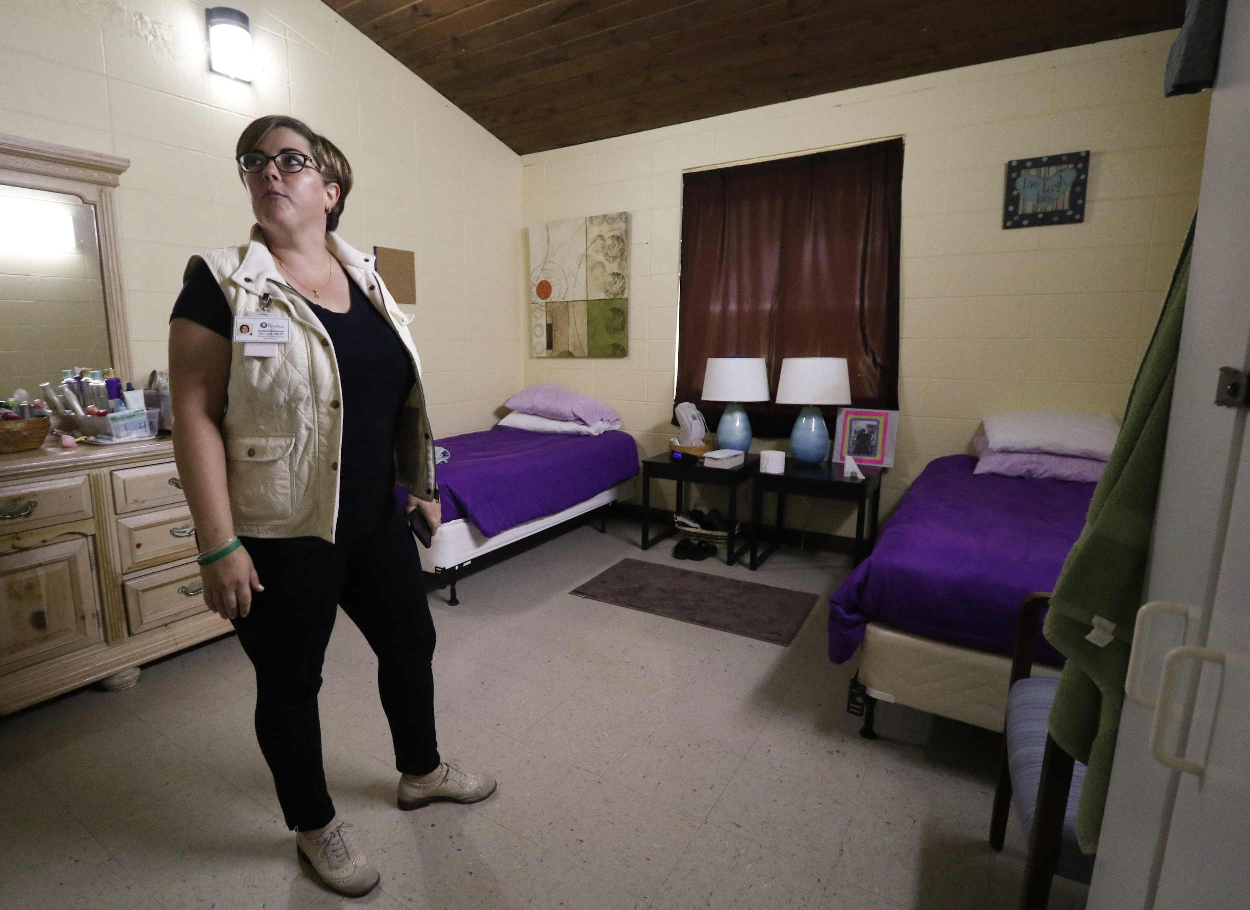 Rebekah Bohannon, Regional Assistant Director of The Next Door, walks through a client's room while speaking about the local nonprofit and the work they do to reintroduce incarcerated women into society.
