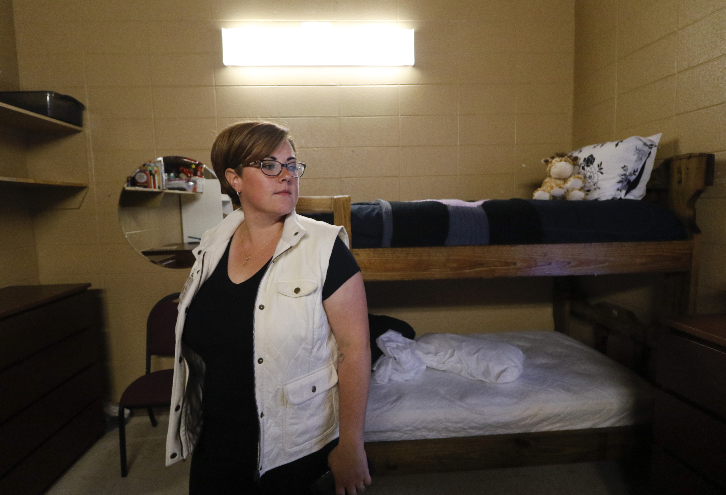 Rebekah Bohannon, Regional Assistant Director of The Next Door, walks through a client's room while speaking about the local nonprofit and the work they do to reintroduce incarcerated women into society.