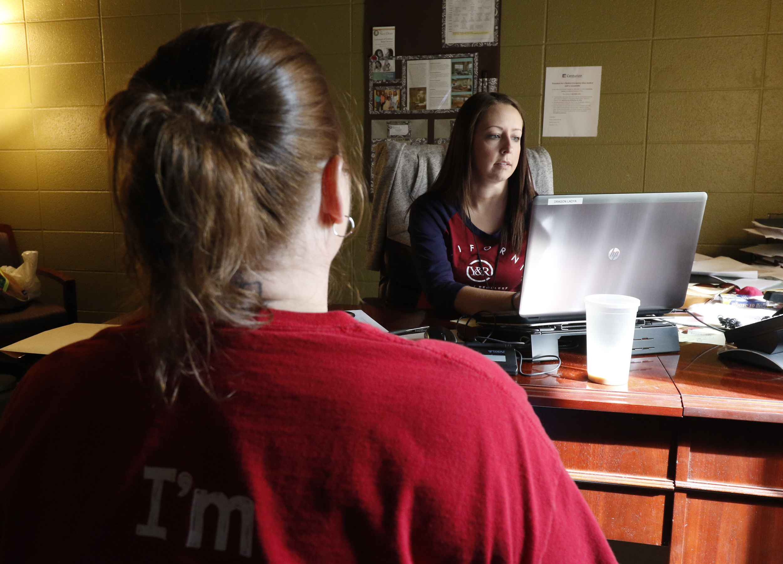 Miranda Chubb, a case manager with The Next Door, speaks to a client who is being released about developing an after care plan while at the local nonprofit on Wednesday, September 16, 2015. The local nonprofit works to reintroduce incarcerated women into society.