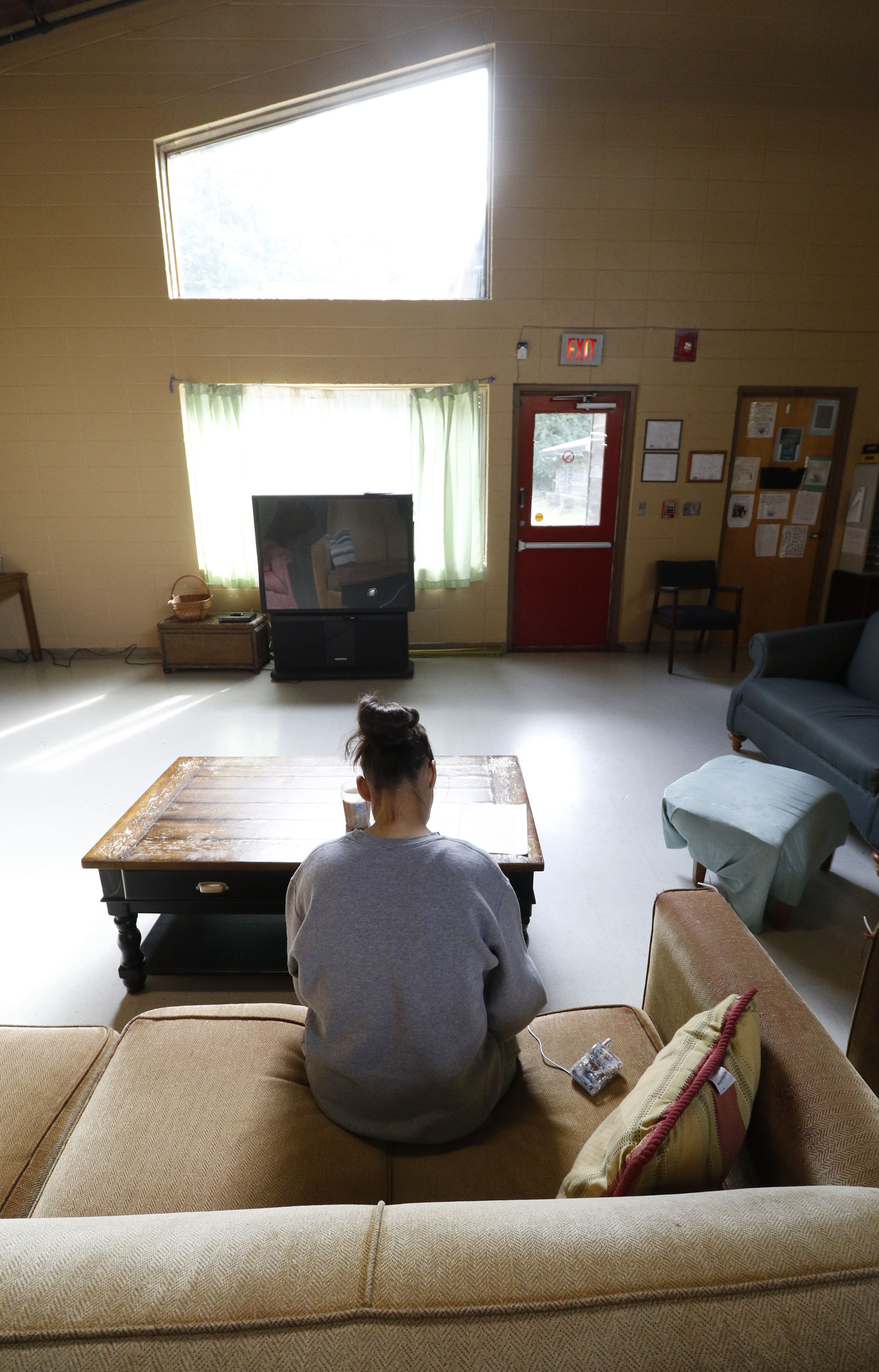 A client at The Next Door writes a letter while at the local nonprofit on Wednesday, September 16, 2015. The local nonprofit works to reintroduce incarcerated women into society.