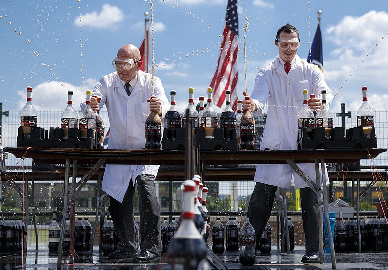 Stephen Voltz, left, and Jason Tardy, who are the YouTube video creators known as EepyBird and known for their Diet Coke and Mentos experiment videos, launch soda for a demonstration during the Chattanooga Mini Maker Faire at the First Tennessee Pavilion on Saturday, Sept. 19, 2015, in Chattanooga, Tenn. The faire is a celebration of creators and their creations, and it showcased makers ranging from technology enthusiasts to crafts artisans.
