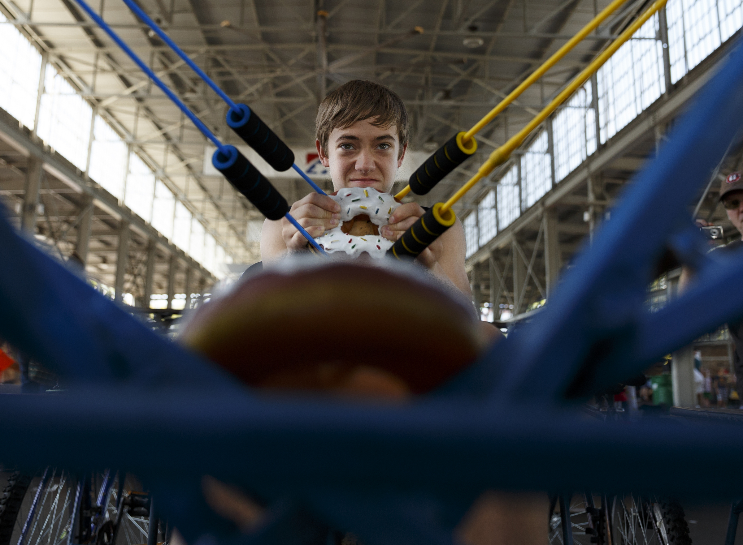 Noah Sherr prepares to launch a plastic donut from a slingshot attached to a bicycle at the Chattanooga Mini Maker Faire at the First Tennessee Pavilion on Saturday, Sept. 19, 2015, in Chattanooga, Tenn. The faire is a celebration of creators and their creations, and it showcased makers ranging from technology enthusiasts to crafts artisans.