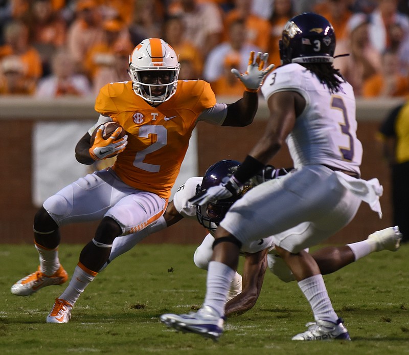 UT's Pig Howard carries as Western Carolina's Fred Payne approaches  Saturday, September 19, 2015 at Neyland Stadium in Knoxville, Tenn.