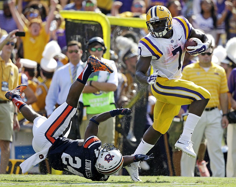 LSU running back Leonard Fournette (7) runs past Auburn defensive back Blake Countess (24) on a touchdown run in the first half of an NCAA college football game in Baton Rouge, La., Saturday, Sept. 19, 2015. 