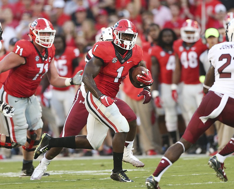 Georgia running back Sony Michel (1) looks for running room in the first half of an NCAA college football game against South Carolina Saturday, Sept. 19, 2015, in Athens, Ga. 