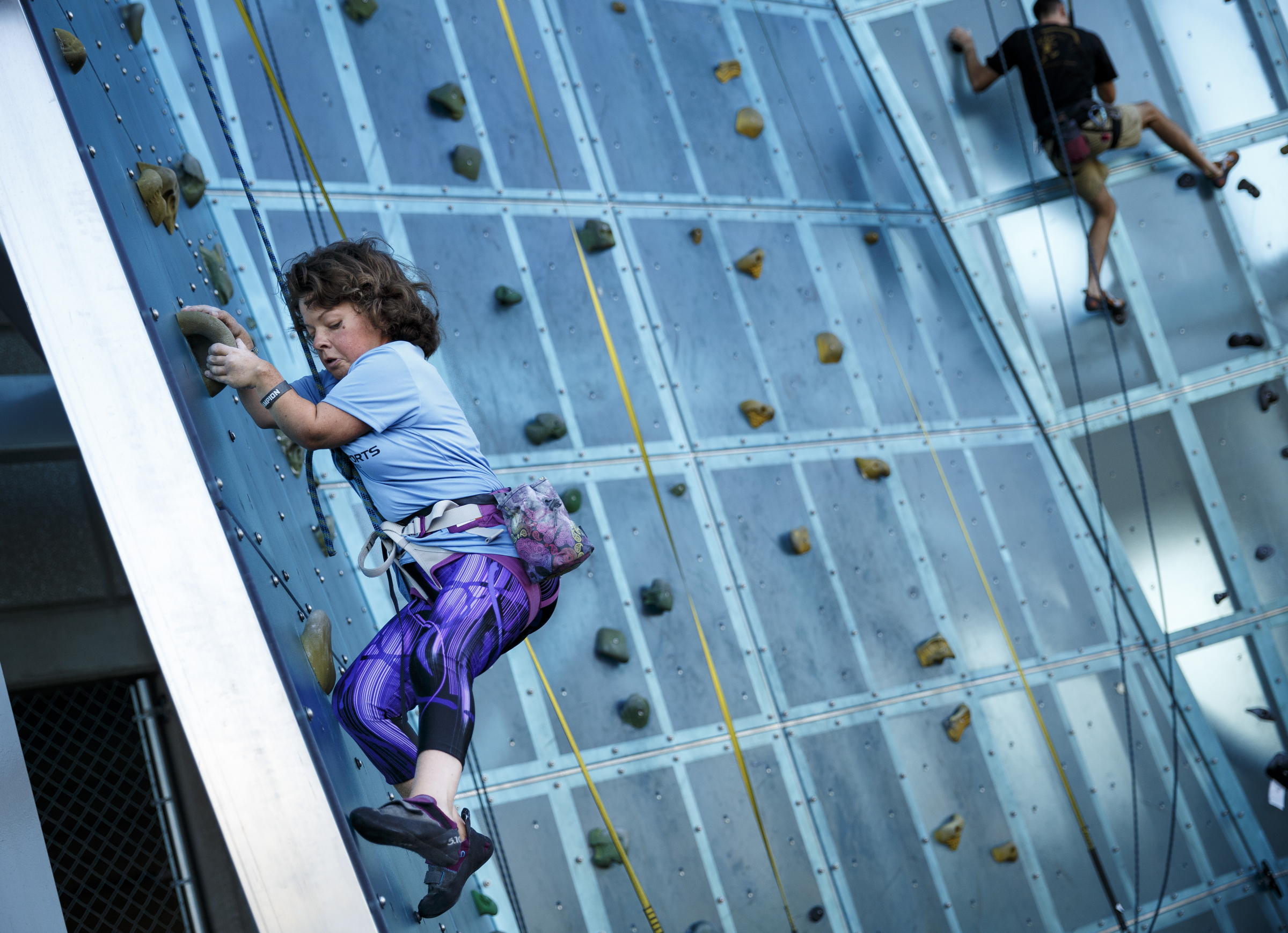 Sharon Stolberg climbs an outdoor wall during an adaptive climbing program at High Point Climbing gym Thursday, Sept. 17, 2015, in Chattanooga, Tenn. The program, which happens on the third Thursday of each month, provides resources to help disabled climbers enjoy the sport.
