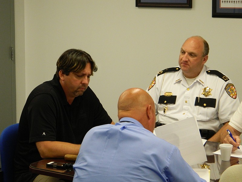 PHOTO BY PAUL LEACH
Bradley County Commission Vice Chairman Jeff Yarber, chairman of the county's law enforcement committee, left, Commissioner Johnny Mull and Sheriff Eric Watson discuss concerns regarding the use of inmates by the Bradley County Road Department and other county departments.