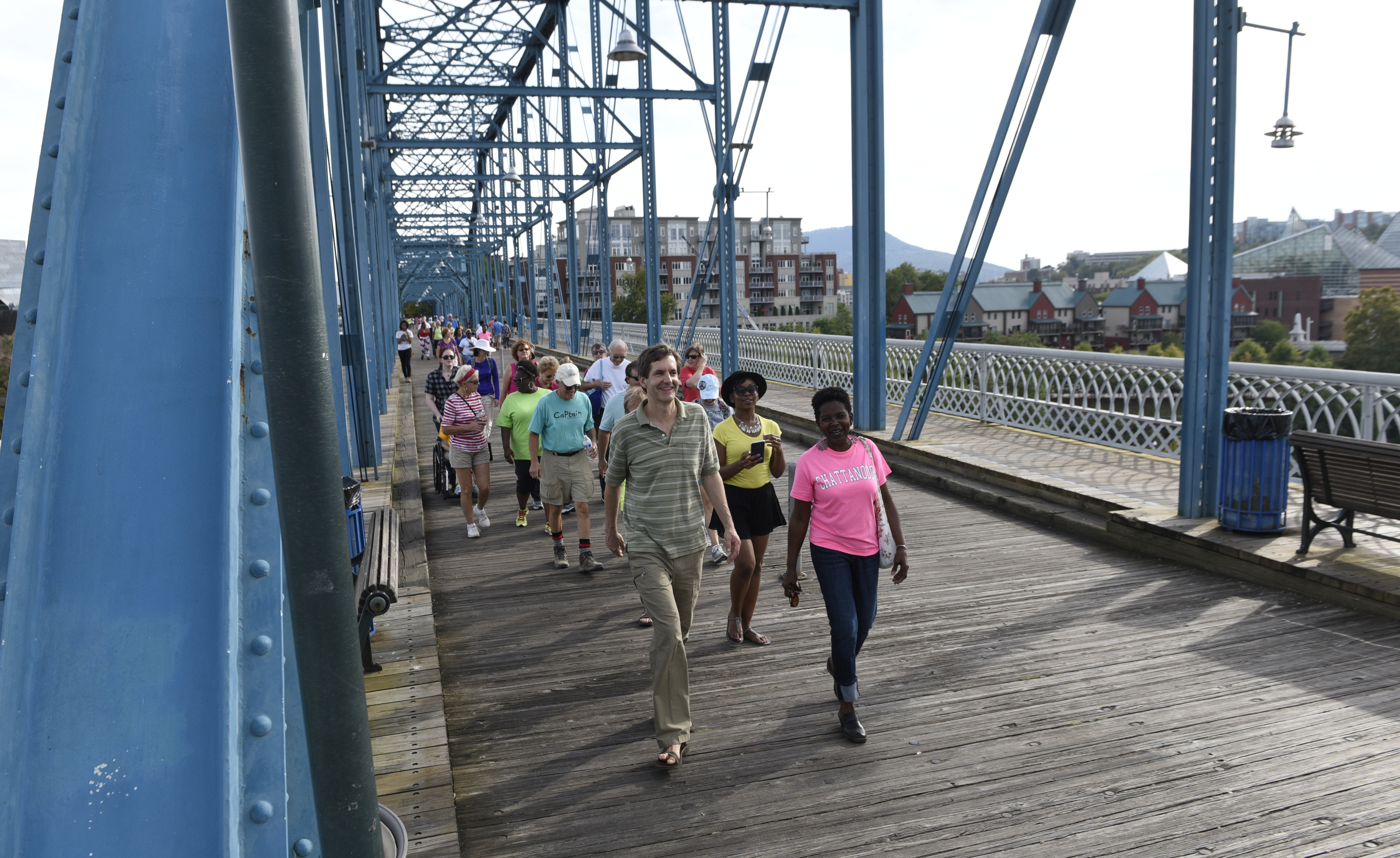 Steve Derthick, left, and Mary Smith lead a group across the Walnut Street Bridge during a prayer walk on Sunday, Sept. 20, 2015, in Chattanooga, Tenn., in remembrance of families affected by violence.