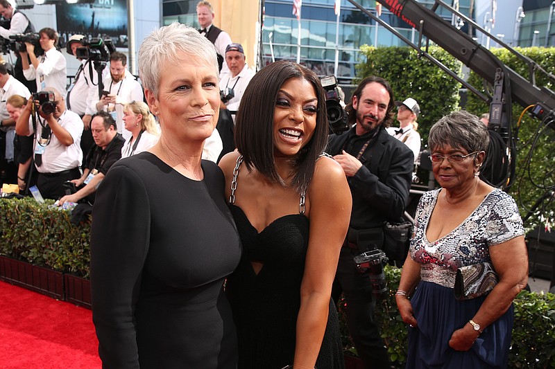 Jamie Lee Curtis and Taraji P. Henson arrive at the 67th Primetime Emmy Awards on Sunday, Sept. 20, 2015, at the Microsoft Theater in Los Angeles. (Photo by @msayles/@Invisionagency for the Television Academy)