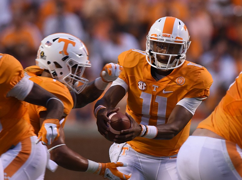 UT quarterback Josh Dobbs hands the ball off in the game against Western Carolina on Saturday, Sept. 19, 2015, at Neyland Stadium in Knoxville.