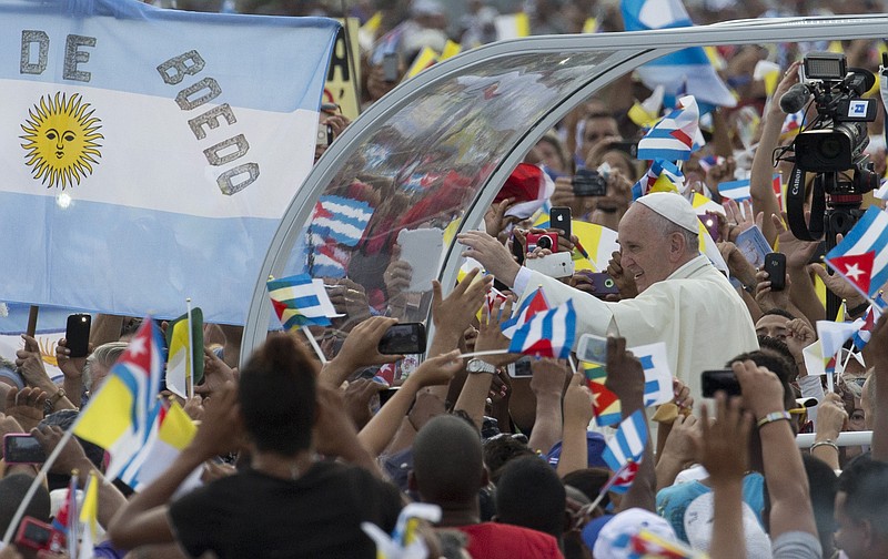 Riding in the popemobile, Pope Francis arrives for Mass at Revolution Plaza in Havana, Cuba, Sunday.