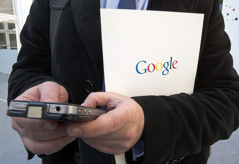 
              FILE - In this Dec.10 2013 file photo, a reporter uses his phone during a presentation for the new Google cultural institute in Paris,  France. France's data privacy regulator has rejected Monday Sept.21, 2015 Google's appeal of an order to remove search results worldwide upon request. (AP Photo/Jacques Brinon, File)
            