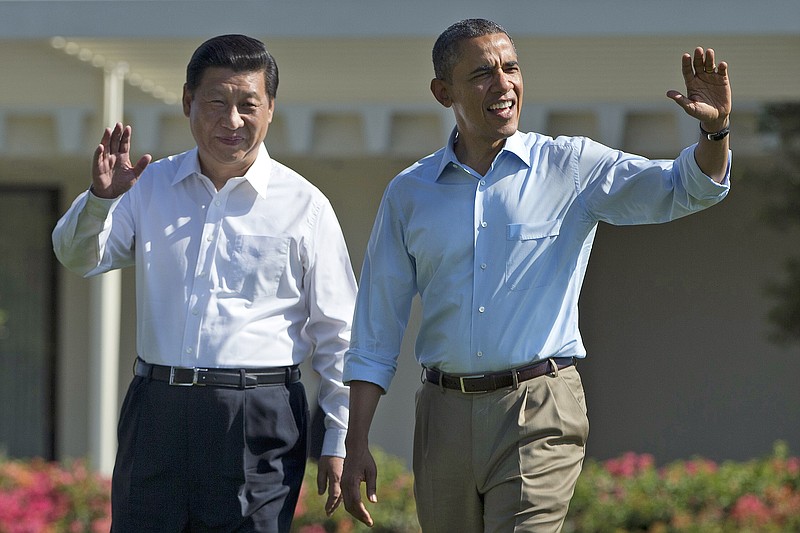 
              FILE - In this June 8, 2013 file photo, Chinese President Xi Jinping, left, and U.S. President Barack Obama walk at the Annenberg Retreat of the Sunnylands estate in Rancho Mirage, Calif. As Obama meets Xi in Washington this week, the world’s two biggest economies are trying to rework their weird relationship as partners and rivals _ the frenemies of the globalized marketplace. (AP Photo/Evan Vucci, File)
            