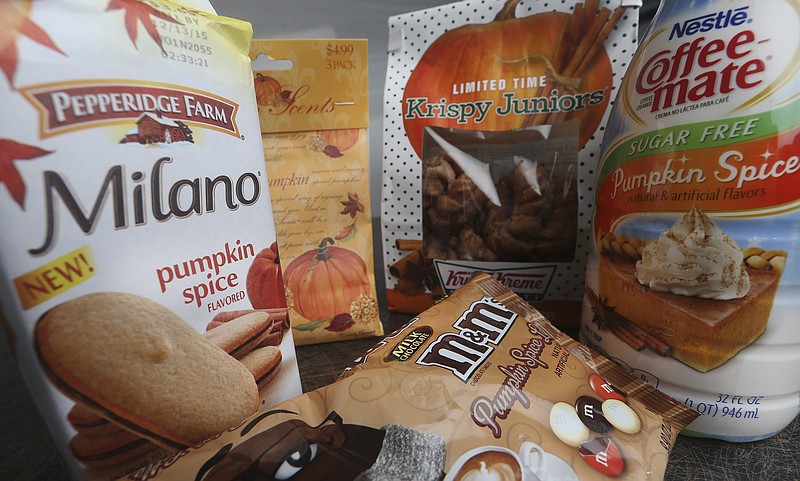 In this photo taken Saturday, Sept. 12, 2015, pumpkin spice products ranging from cookies and donuts to candy and air freshener are shown in Atlanta.