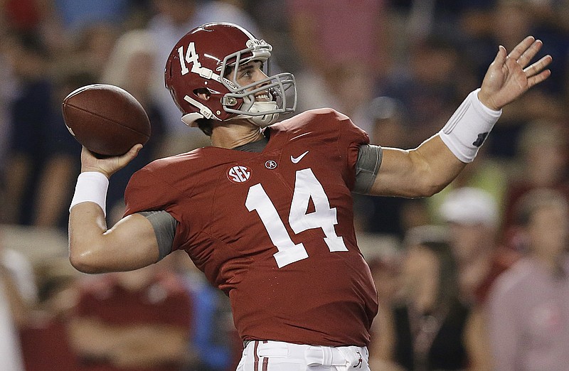 Alabama quarterback Jake Coker warms up for an NCAA college football game against Mississippi on Saturday, Sept. 19, 2015, in Tuscaloosa, Ala.