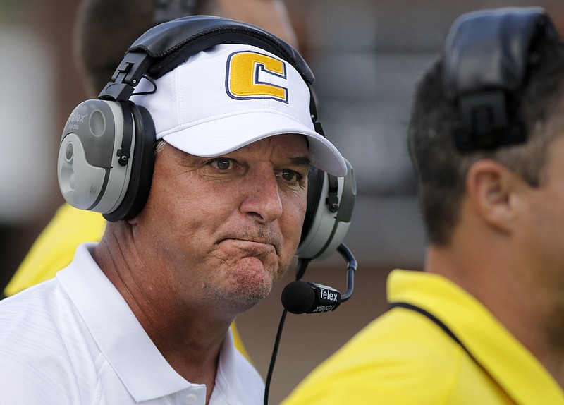 UTC head football coach Russ Huesman shouts to players after a Mars Hill touchdown during the Mocs' football game against the Lions at Finley Stadium on Saturday, Sept. 12, 2015, in Chattanooga. UTC won 44-34.