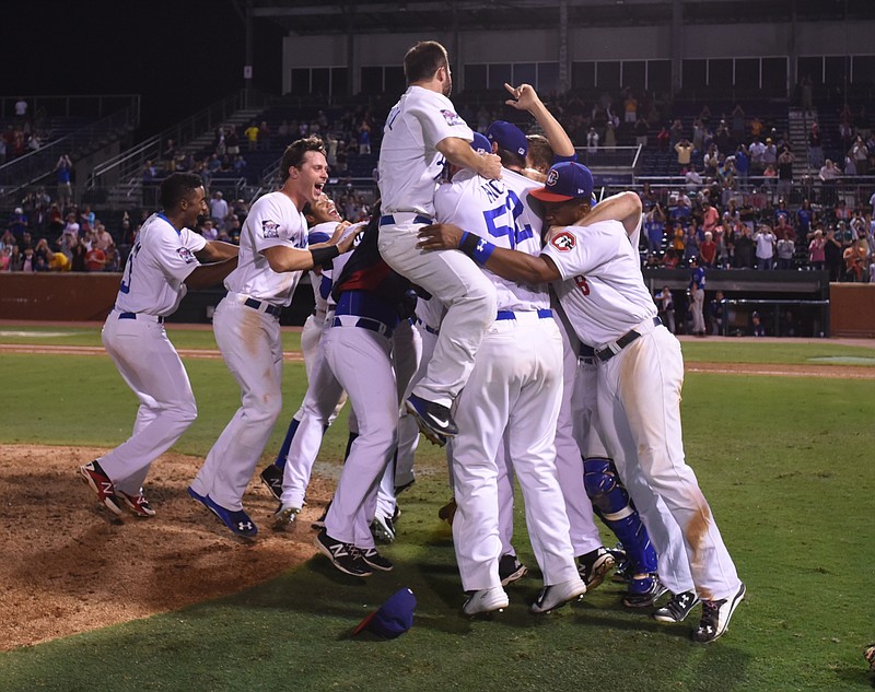 The Chattanooga Lookouts celebrate their Southern League championship win over the Biloxi Shuckers Monday at AT&T Field.