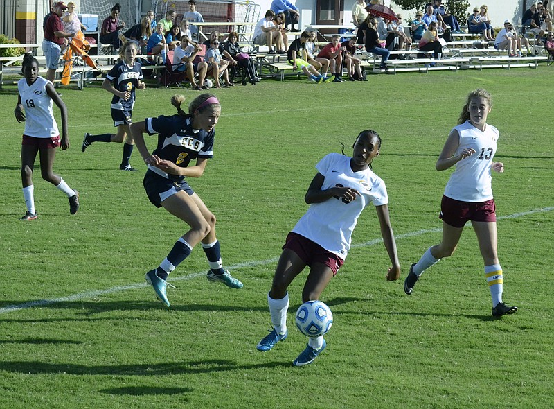 Olivia Hoffman of Chattanooga Christian School shoots while Ebony Ransby and Maddie Ferrell defend as Grace Academy hosts CCS in a girls soccer game on Tuesday, Sept. 22, 2015, in Chattanooga, Tenn. CCS beat Grace 7-1.