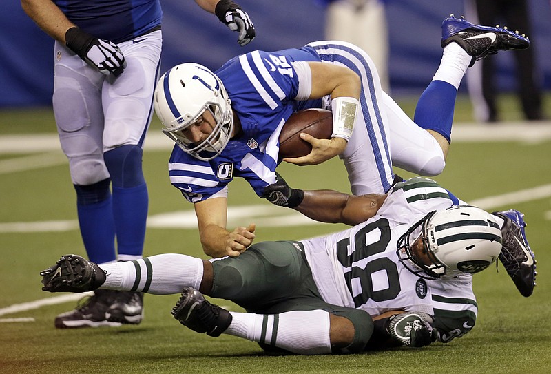 
              New York Jets outside linebacker Quinton Coples (98) sacks Indianapolis Colts quarterback Andrew Luck (12) in the second half of an NFL football game in Indianapolis, Monday, Sept. 21, 2015. (AP Photo/AJ Mast)
            