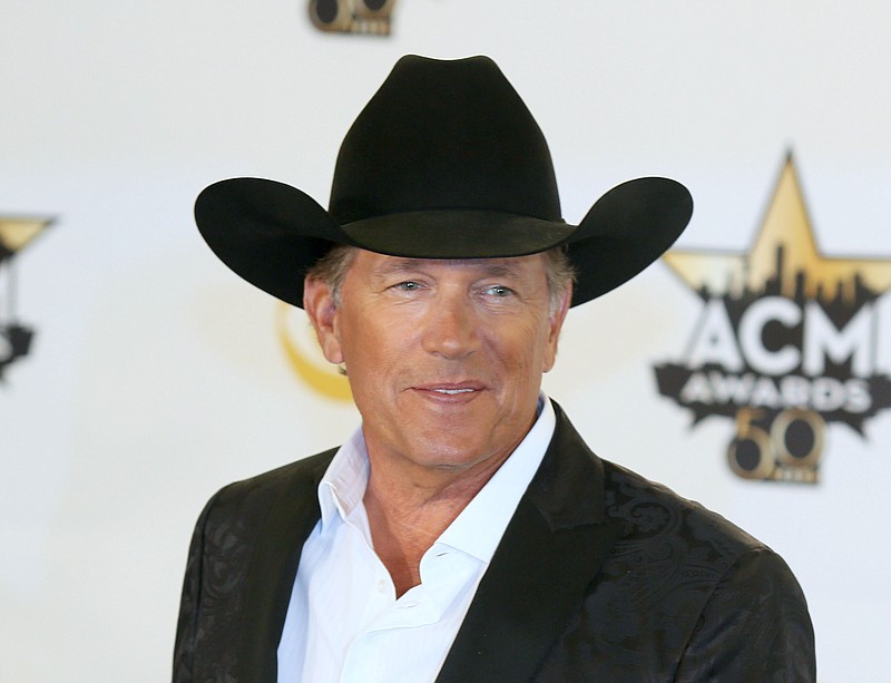 
              FILE - In this April 19, 2015 file photo, George Strait poses in the press room with the milestone award at the 50th annual Academy of Country Music Awards in Arlington, Texas. Strait announced on Tuesday, Sept. 22, that he’s releasing a new album, “Cold Beer Conversation,” on Friday and that he’ll play a series of shows at the new Las Vegas Arena when it opens in 2016. (Photo by Jack Plunkett/Invision/AP, File)
            