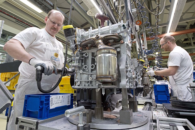 Workers assemble engines at a Volkswagen plant in Germany in this file photo.