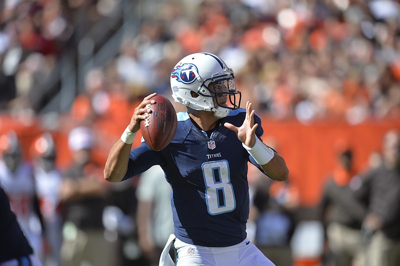 Tennessee Titans quarterback Marcus Mariota (8) throws a 19-yard touchdown pass against the Cleveland Browns during an NFL football game Sunday, Sept. 20, 2015, in Cleveland.