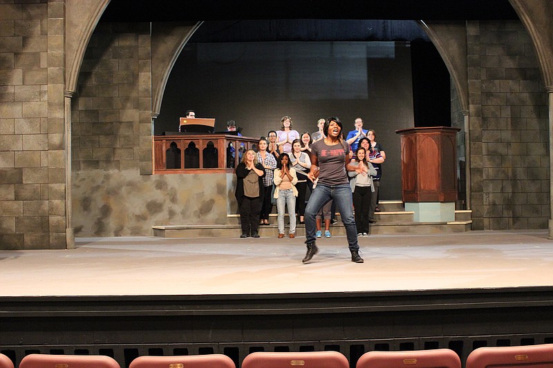 Kimberly Johnson gets into the music as singer Deloris Van Cartier/Sister Mary Clarence in this rehearsal photo from "Sister Act, A Divine Musical," now playing at the Chattanooga Theatre Centre.