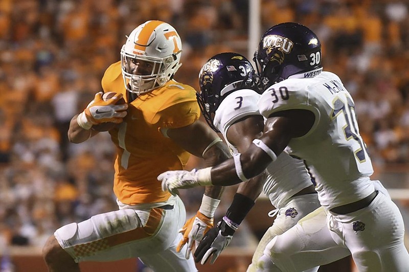 Tennessee running back Jalen Hurd heads for the goal line with Western Carolina's Fred Payne (3) and A.J. McKoy (30) in pursuit during the Volunteers' 55-10 win over the Catamounts last Saturday in Knoxville. Hurd has 300 yards on 58 carries (5.2 average) this season and has scored five of Tennessee's 10 rushing touchdowns.