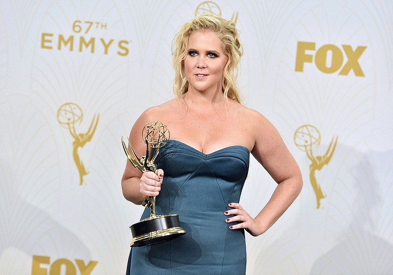 
              FILE - In this Sept. 20, 2015 file photo, Amy Schumer, winner of the award for outstanding variety sketch series for "Inside Amy Schumer", poses in the press room at the 67th Primetime Emmy Awards in Los Angeles. Schumer has a deal with Gallery Books for a memoir scheduled to come out late next year. The publisher told The Associated Press on Wednesday that the book is currently untitled. (Photo by Jordan Strauss/Invision/AP, File)
            