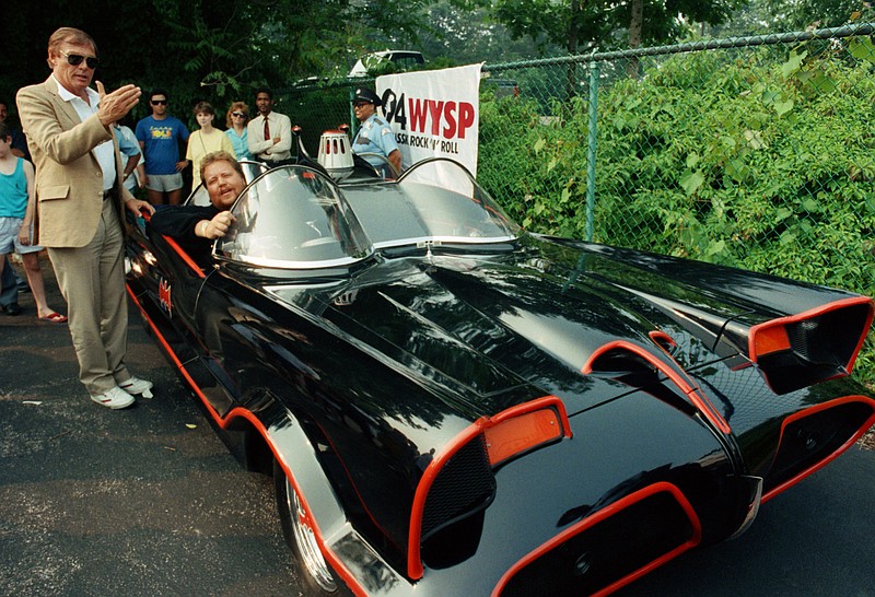 
              FILE - In this June 27, 1989 file photo, the original Batman, Adam West, left, stands beside the old Batmobile driven by owner Scott Chinery in Philadelphia. Batman won't have to worry about Batmobile knockoffs after a federal appeals court ruled the caped crusader's vehicle is entitled to copyright protection. The 9th U.S. Circuit Court of Appeals said Wednesday, Sept. 23, 2015, the Batmobile's bat-like appearance and other distinct traits make it a character that can't be replicated without permission from DC Comics, the copyright holder.   (AP Photo/Cristy Rickard, File)
            