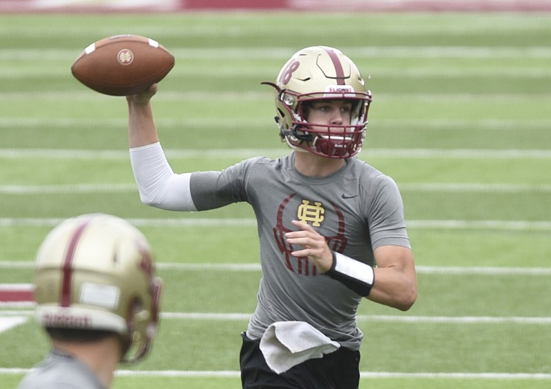 Quarterback Tyson Cooper throws a pass during football practice at Christian Heritage High School on Thursday, Sept. 24, 2015, in Dalton, Ga.