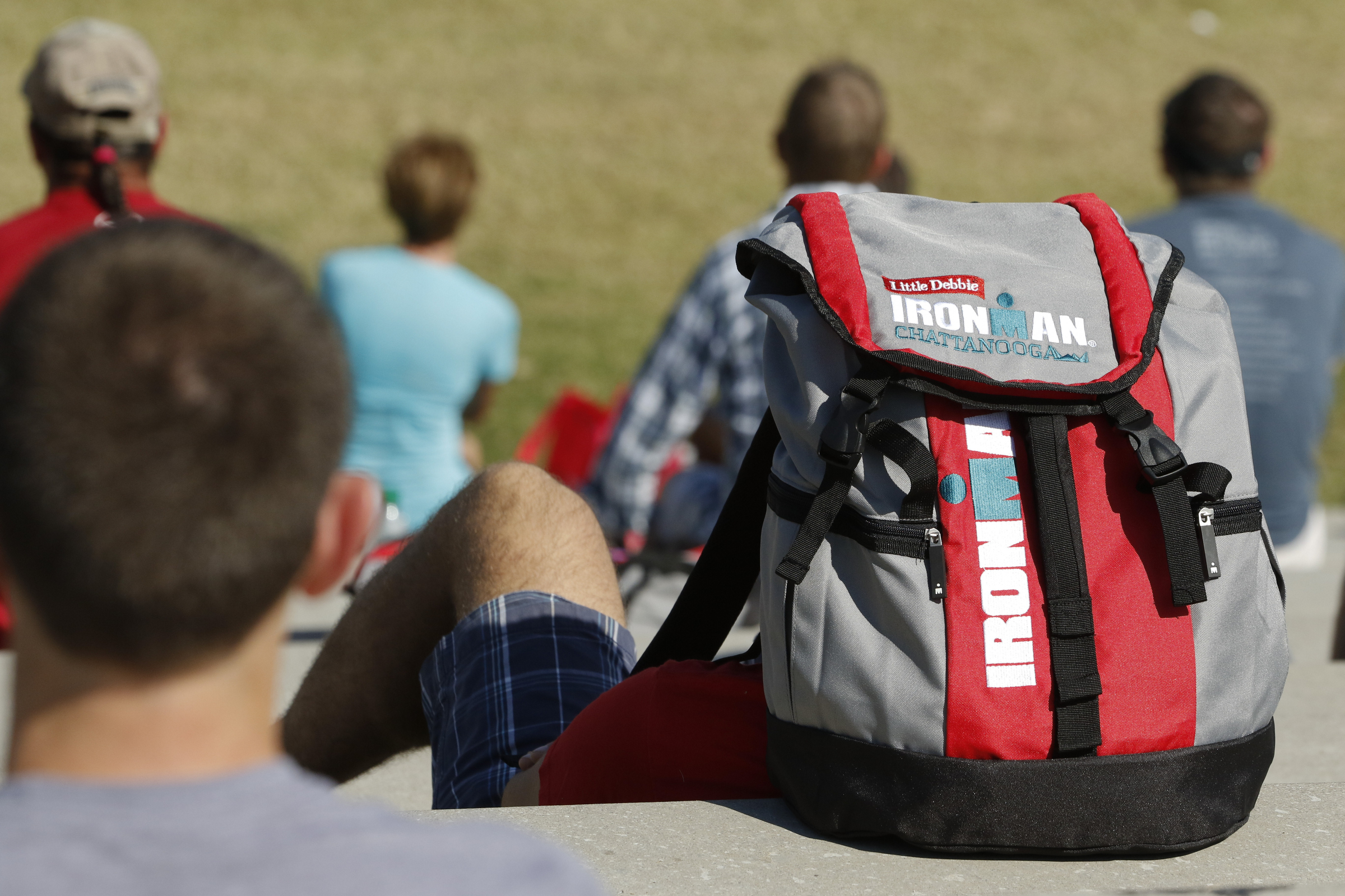 Competitors listen to the first athlete briefing meeting of the day in preparation for the second annual Ironman Chattanooga triathlon which will take place Sunday, September 27, 2015.