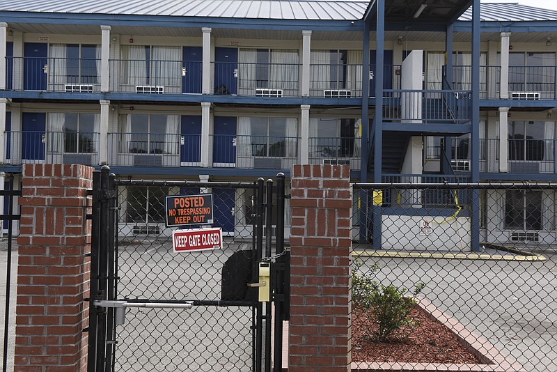 "No trespassing" signs are visible on the fence at Superior Creek Lodge in East Ridge., Tenn. Some 1,500 people were made homeless when East Ridge condemned the buildings because they are unsafe.