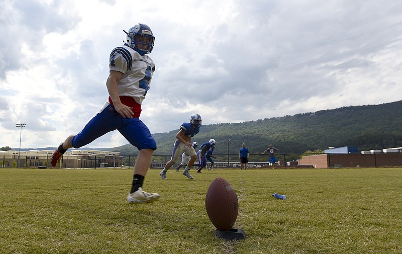 Red Bank High School kicker Sandi Beganovic, kicks off during practice on Tuesday, Sept. 22, 2015, in Red Bank, Tenn. He was born in the USA, but his parents moved to this country during the unrest in Bosnia. The Red Bank senior played soccer all his life, but had never played American football until he became the team's kicker this year. 