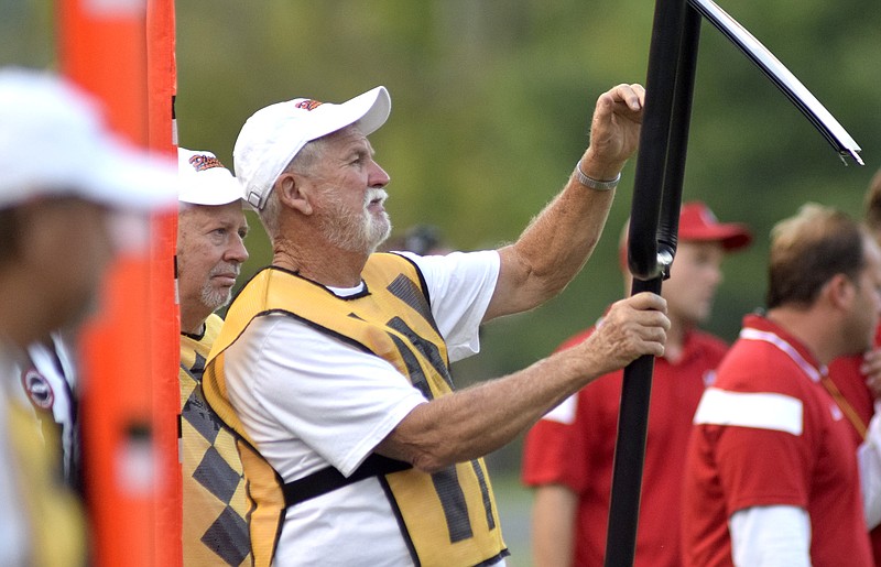 East Ridge chain gang member Doug Rosser flips the down marker.  Rosser has been working the chains for the Pioneers for over 48 years.  The East Ridge Pioneers hosted the Signal Mountain Eagles at Baylor School in TSSAA football action on Friday September 4, 2015.