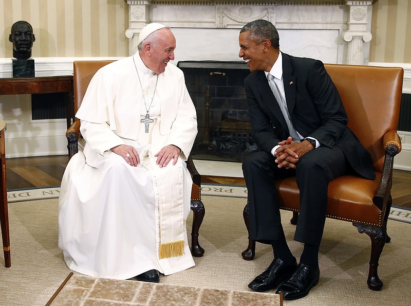 President Barack Obama talks with Pope Francis in the Oval Office of the White House in Washington on Wednesday.