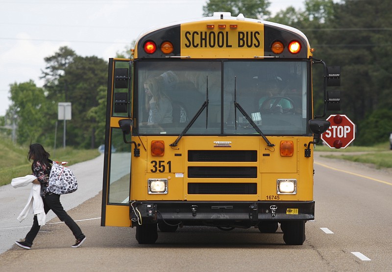 A Hamilton County student gets off a bus in this file photo.